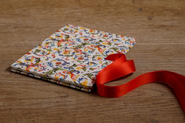 colorful mini photo album in Florentine style and red satin bow
